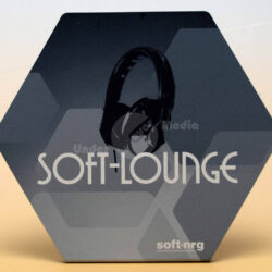 Hexagon-shaped sign featuring the text "SOFT-LOUNGE" and an illustration of headphones, representing a lounge or audio space.